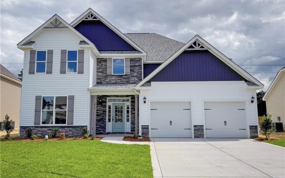 A newly built two-story Maryland home with stone accents and a two-car garage