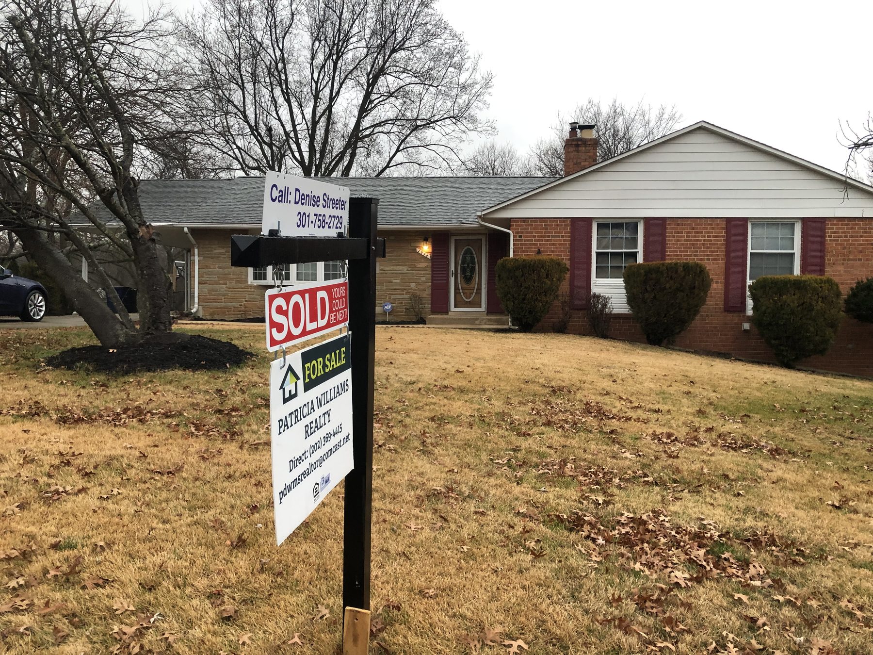 A brick rancher with a PWR sold sign in the front yard