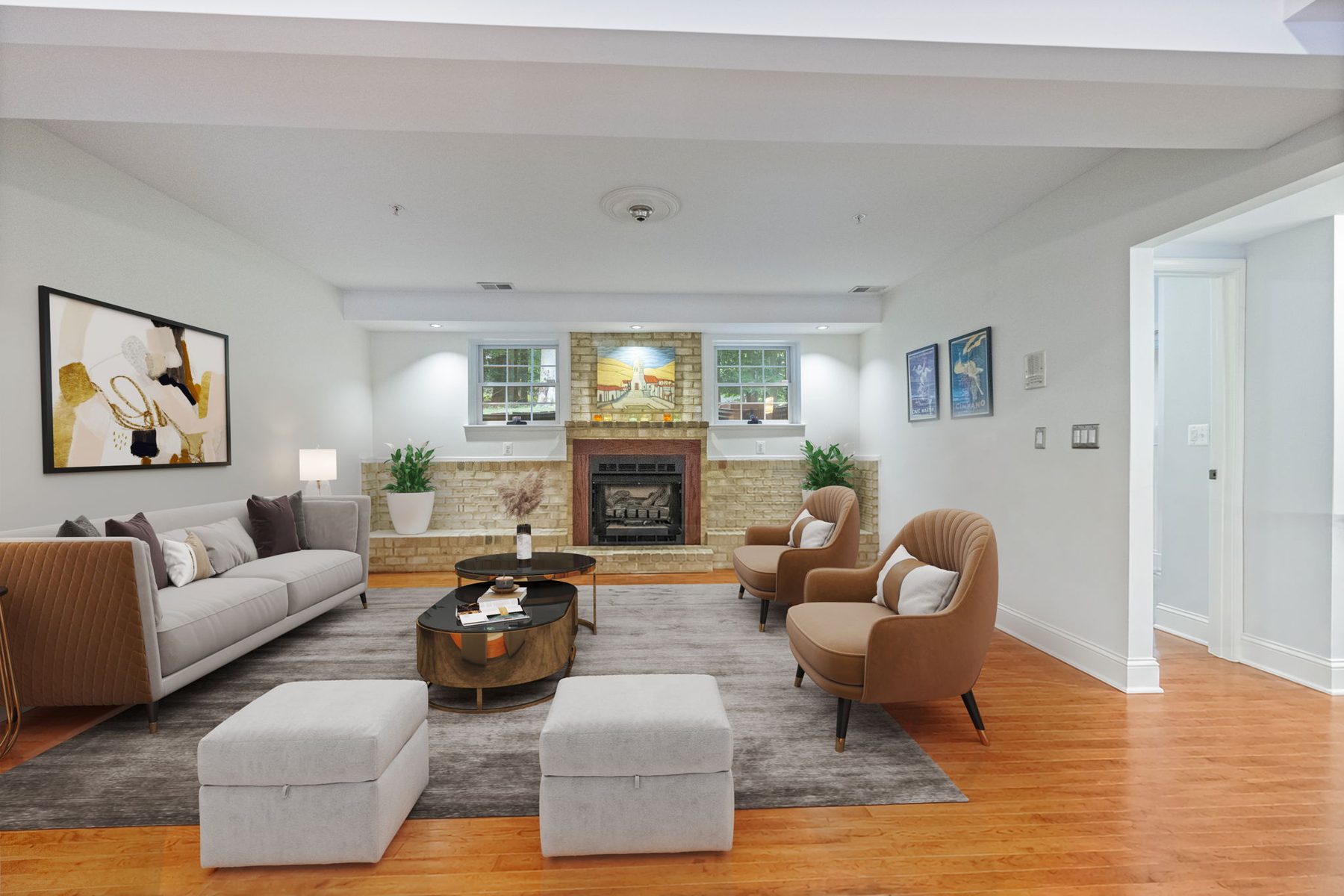 A family room with a fireplace, virtually staged with sofas and ottomans