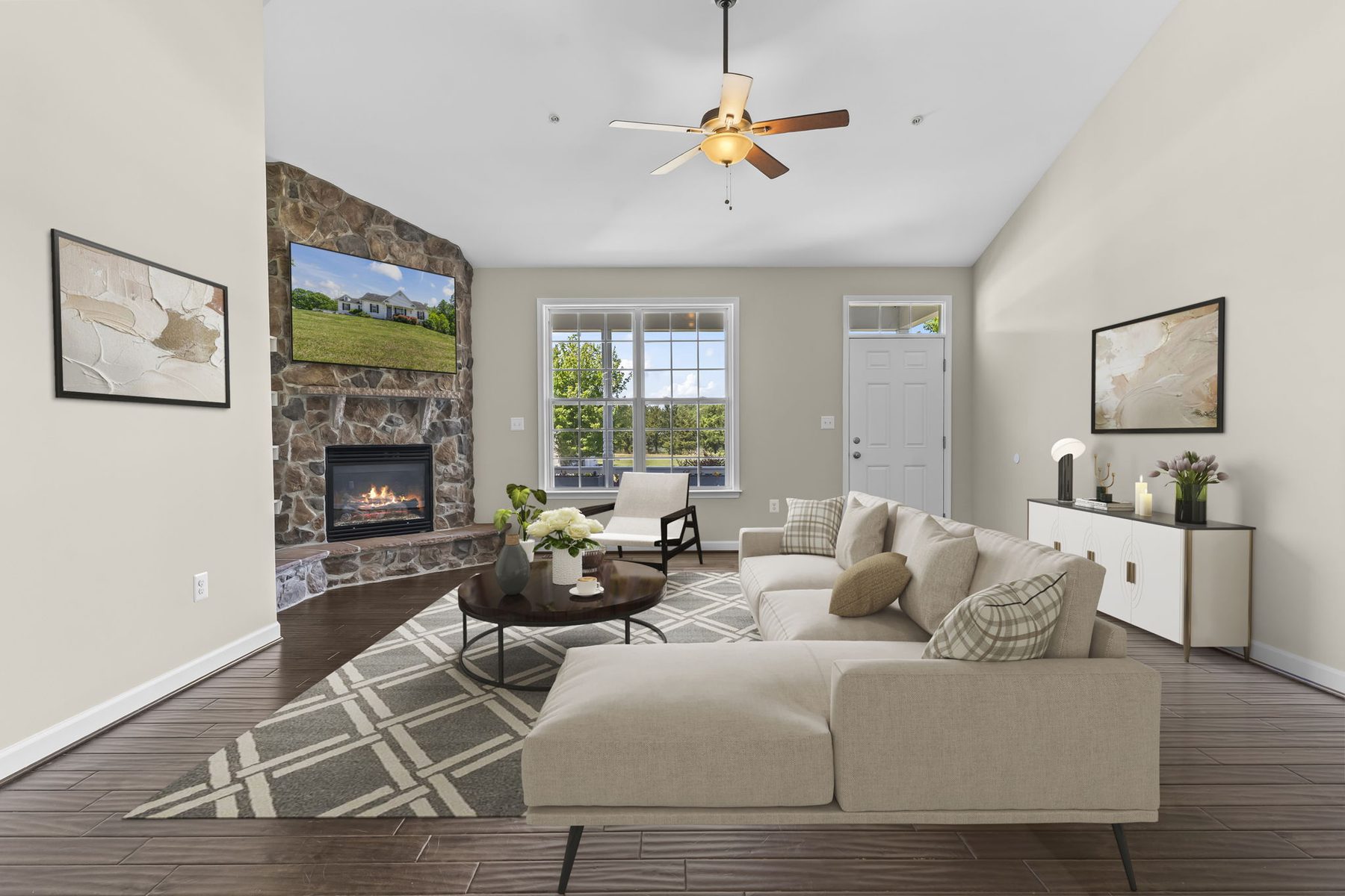 A living room with a stone fireplace, virtually staged